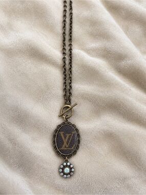 Vintage-Inspired Brown and Gold Logo Pendant Necklace with Opalescent Charm